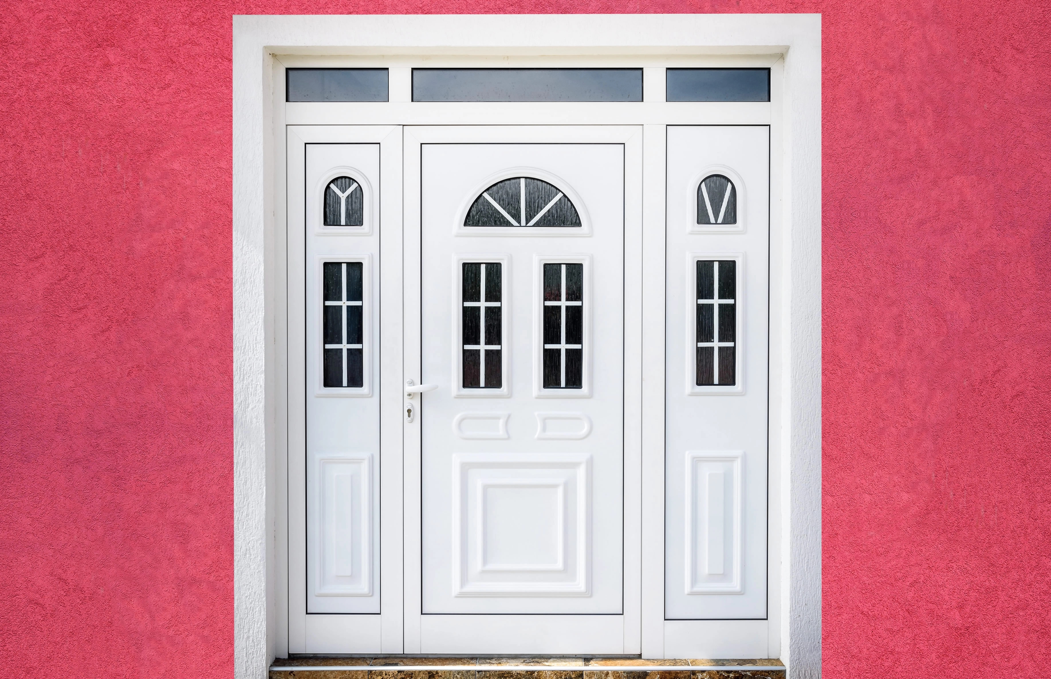 A uPVC Door in white with red painted house