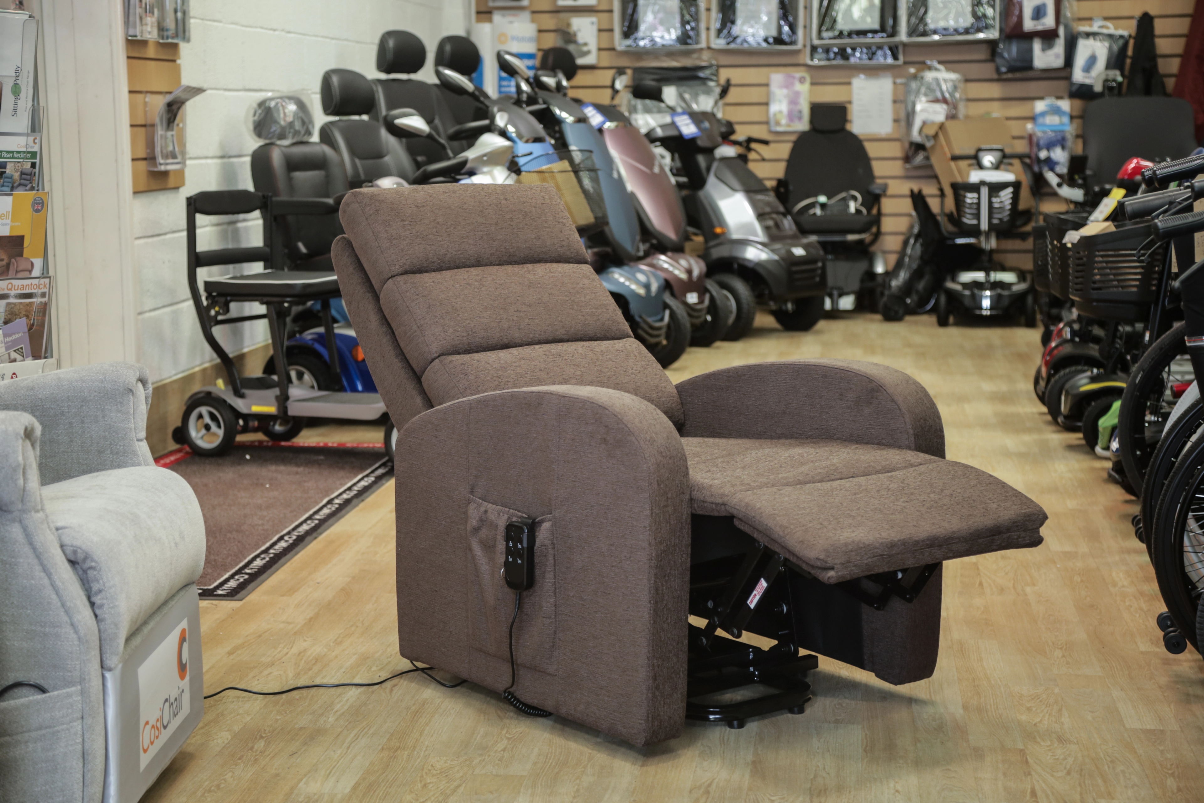 An image of a reclining mobility chair in a showroom