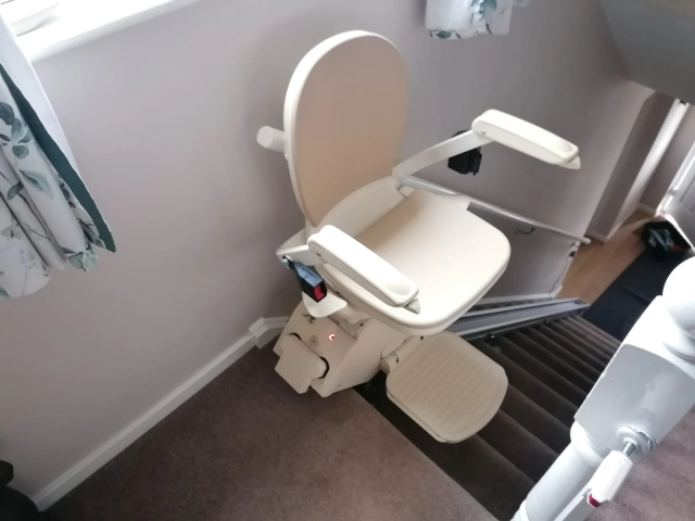 Image of an installed Acorn Stairlift in a neutral colour