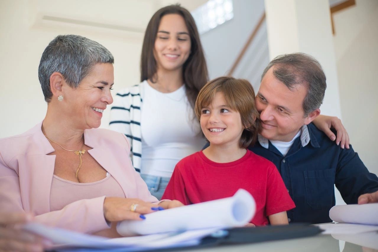 A family with child, signing documents