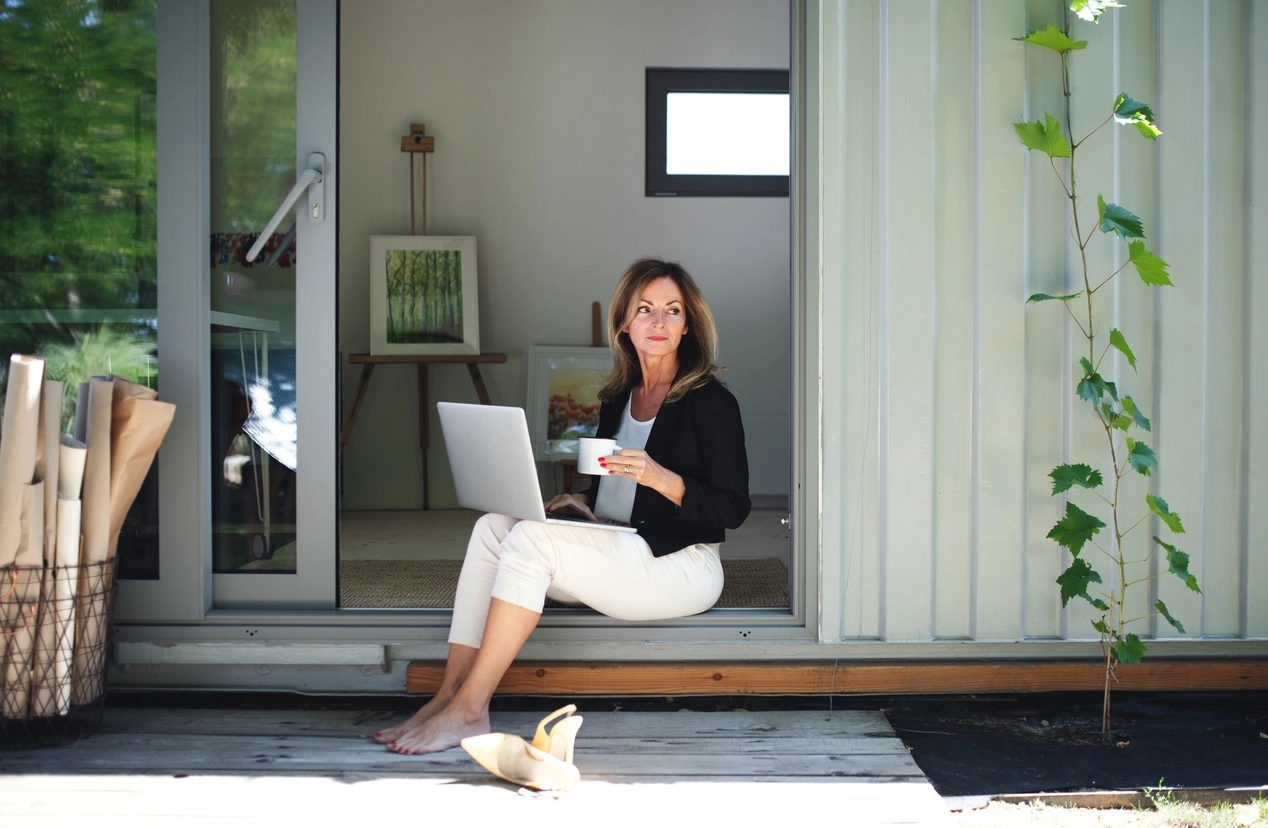 woman sitting in a garden room