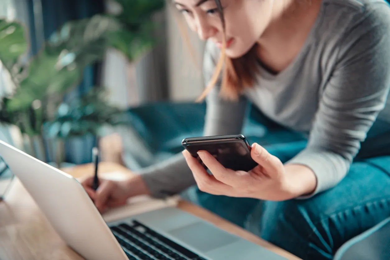 Woman with a calculator looking to save money