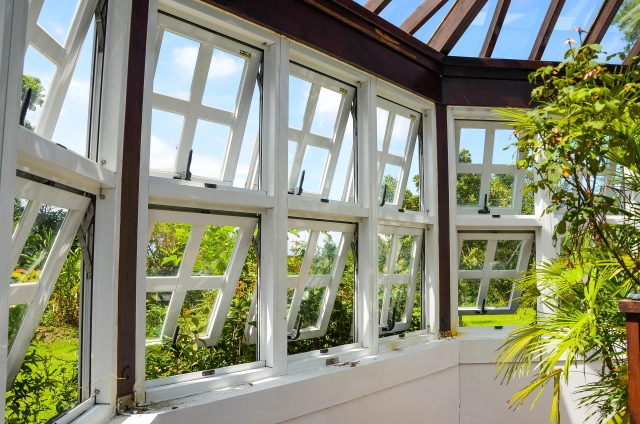Photo of a modern conservatory with new windows overlooking a garden