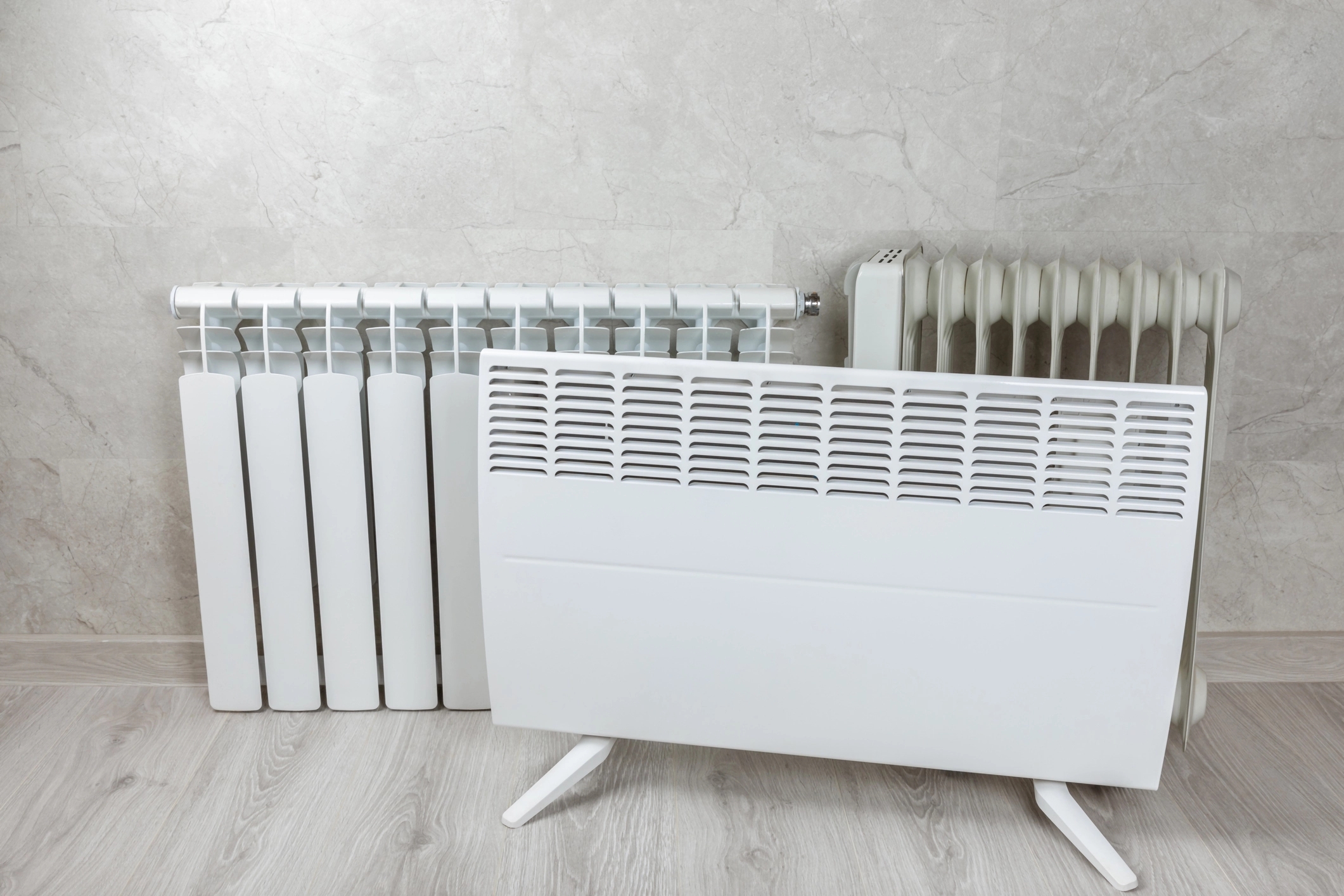An image of 3 different types of radiators with different designs and aesthetics