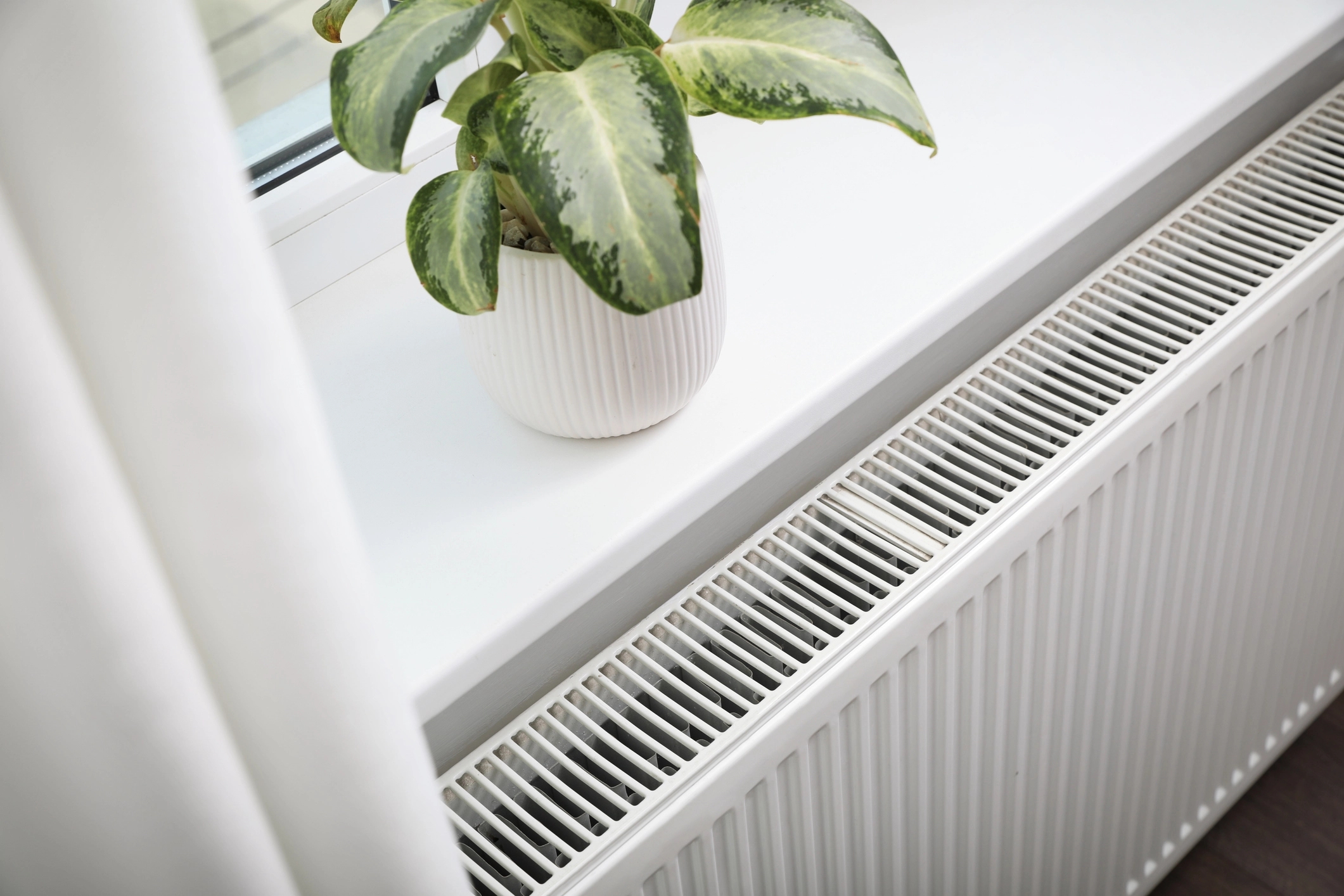 Fan assisted radiator installed in a home
